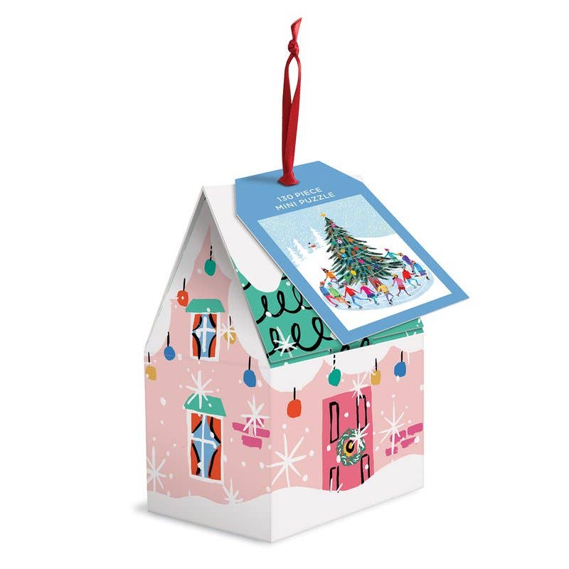 Christmas-themed mini puzzle in a decorative house-shaped box on a white background