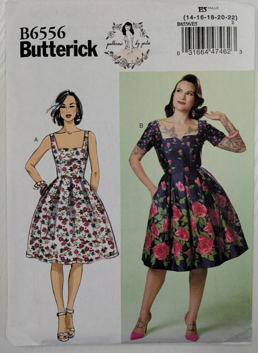 Butterick sewing pattern with a model wearing a floral dress on a white background