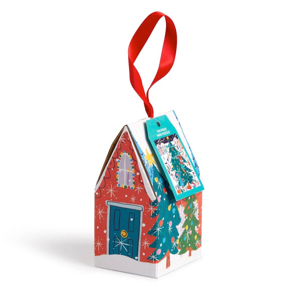Christmas-themed house shaped gift box filled with a jigsaw puzzle, with a red ribbon on a white background