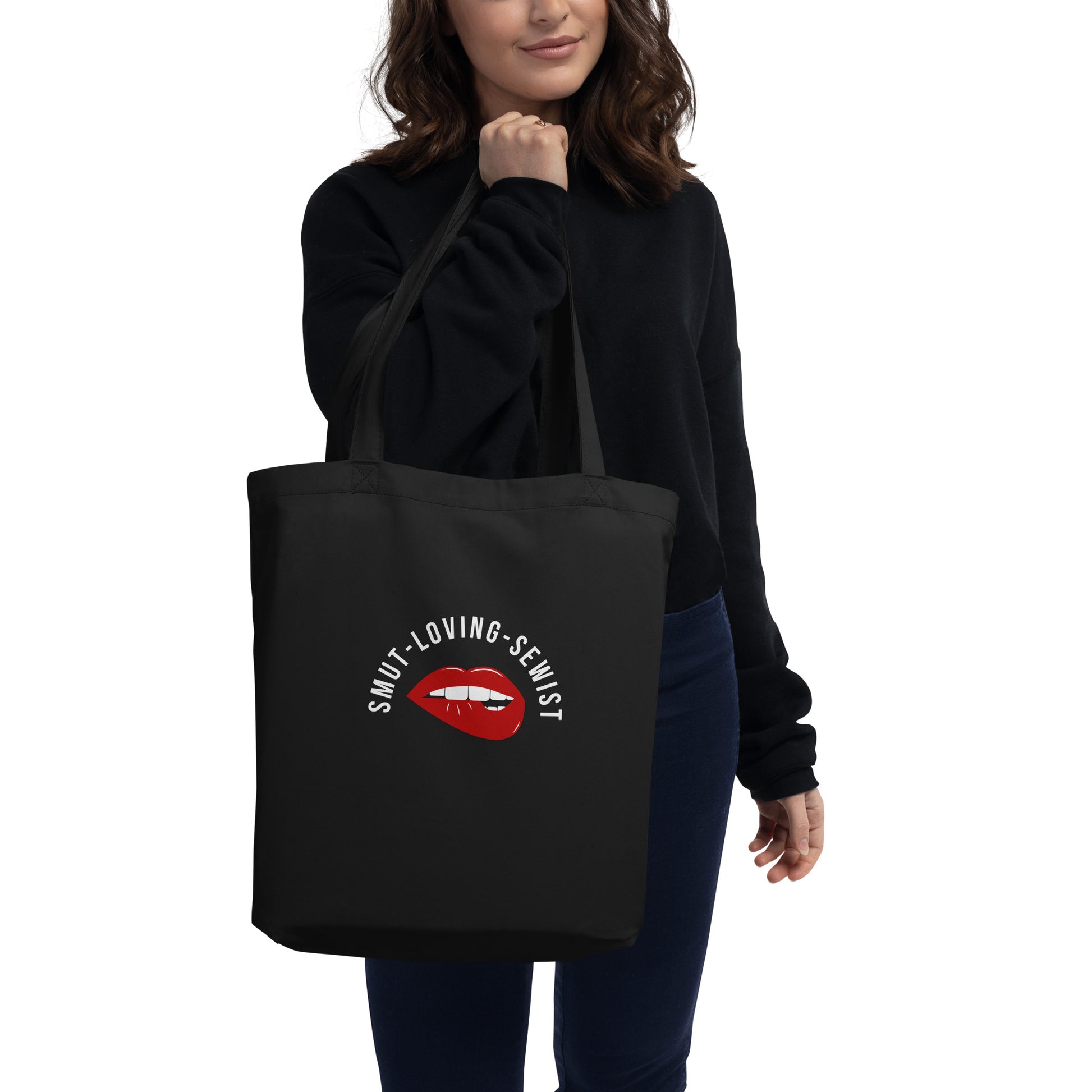 Woman holding a black Smut Loving Sewist Tote