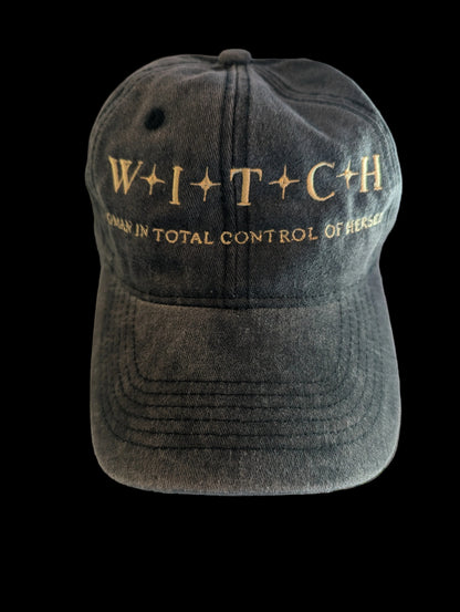 Black vintage washed cap with gold text on a black background