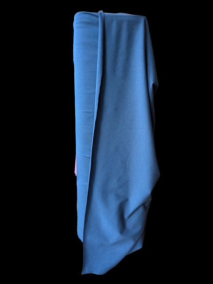 Navy blue cotton spandex fabric draped over the bolt