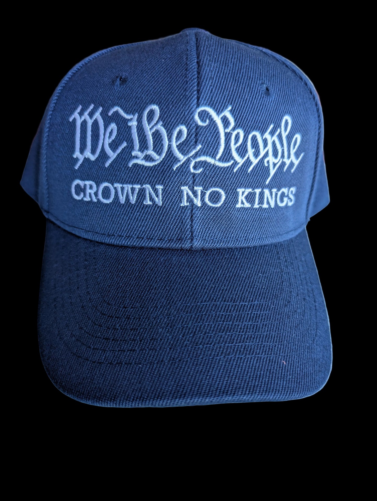 Navy blue cap with white text 'We the People Crown No Kings' 