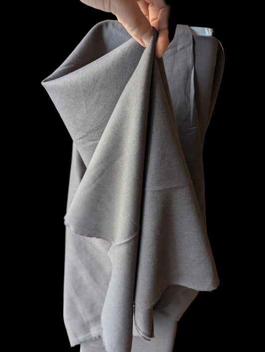 Gray Cotton linen blend held up to show structured drape.